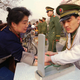 A free health check from an army medic on a Beijing sidewalk on International Women’s Day 1997. Army and other groups offered free haircuts and medical check-ups across Beijing.